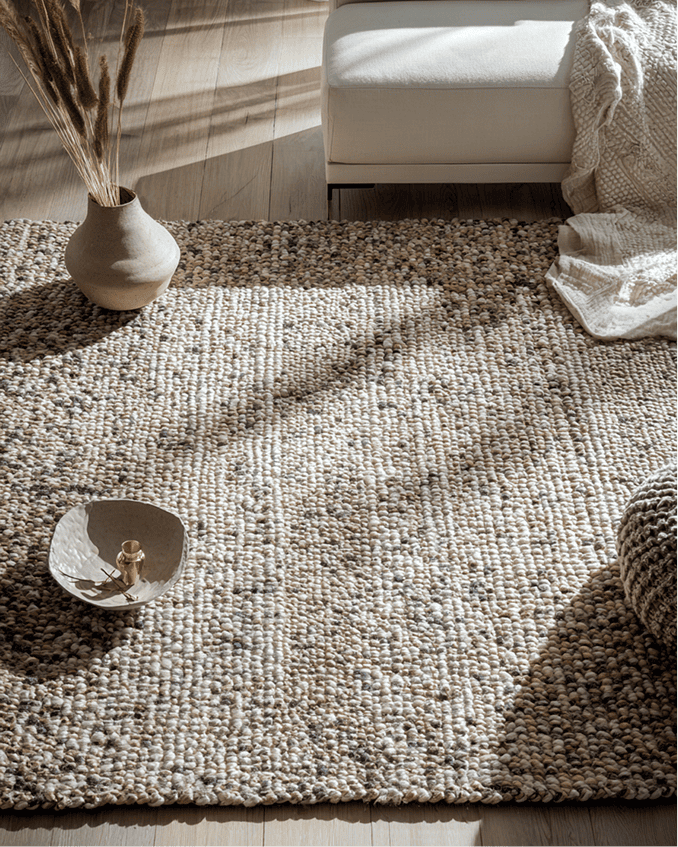 Designer rug with custom binding in living room