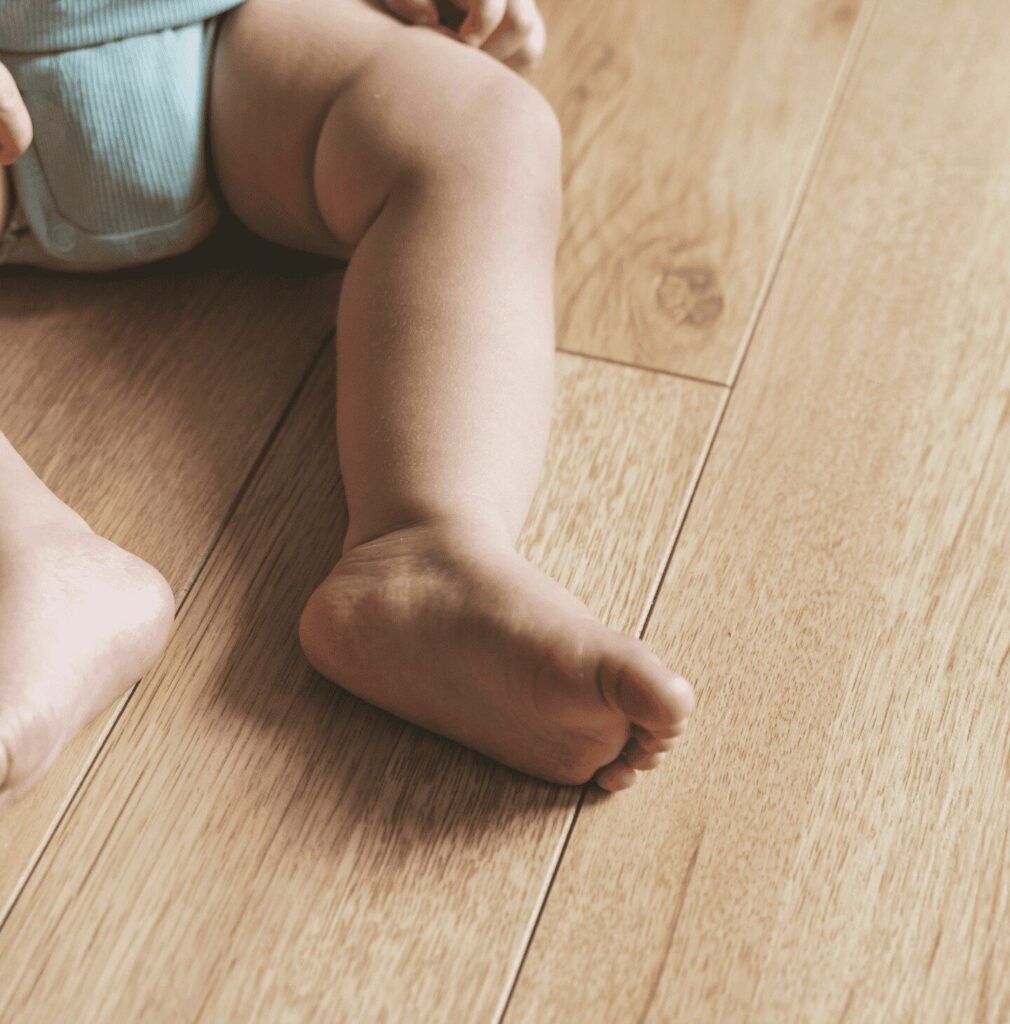 Baby sitting on laminate flooring