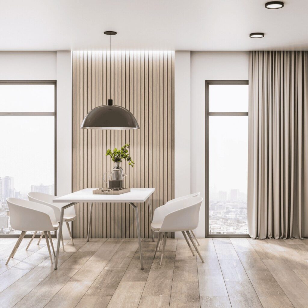 Dinning area in large room with wood floors